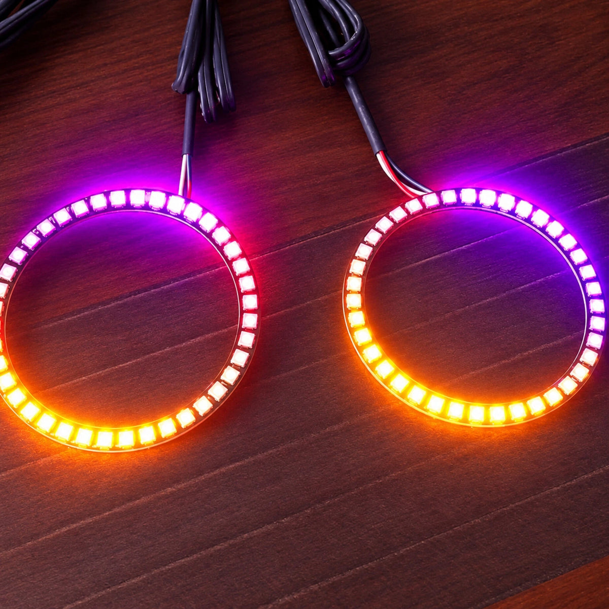Two LED halo rings displaying purple and yellow lighting
