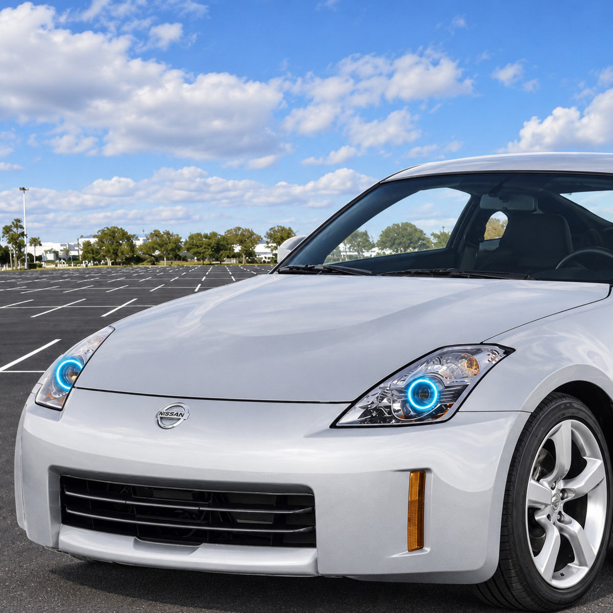 Silver 2008 Nissan 350Z showing cyan halo rings in the headlights
